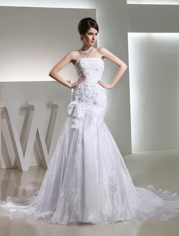 Trumpet/Mermaid Strapless Long Sleeveless Beading Organza Wedding Dresses